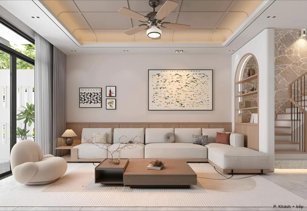 Nội thất phòng khách tầng 1 nhà anh Quân Hà Nam, sofa dáng cong, tranh Matisse, mảng tường đá rối cầu thang, rèm voan trắng